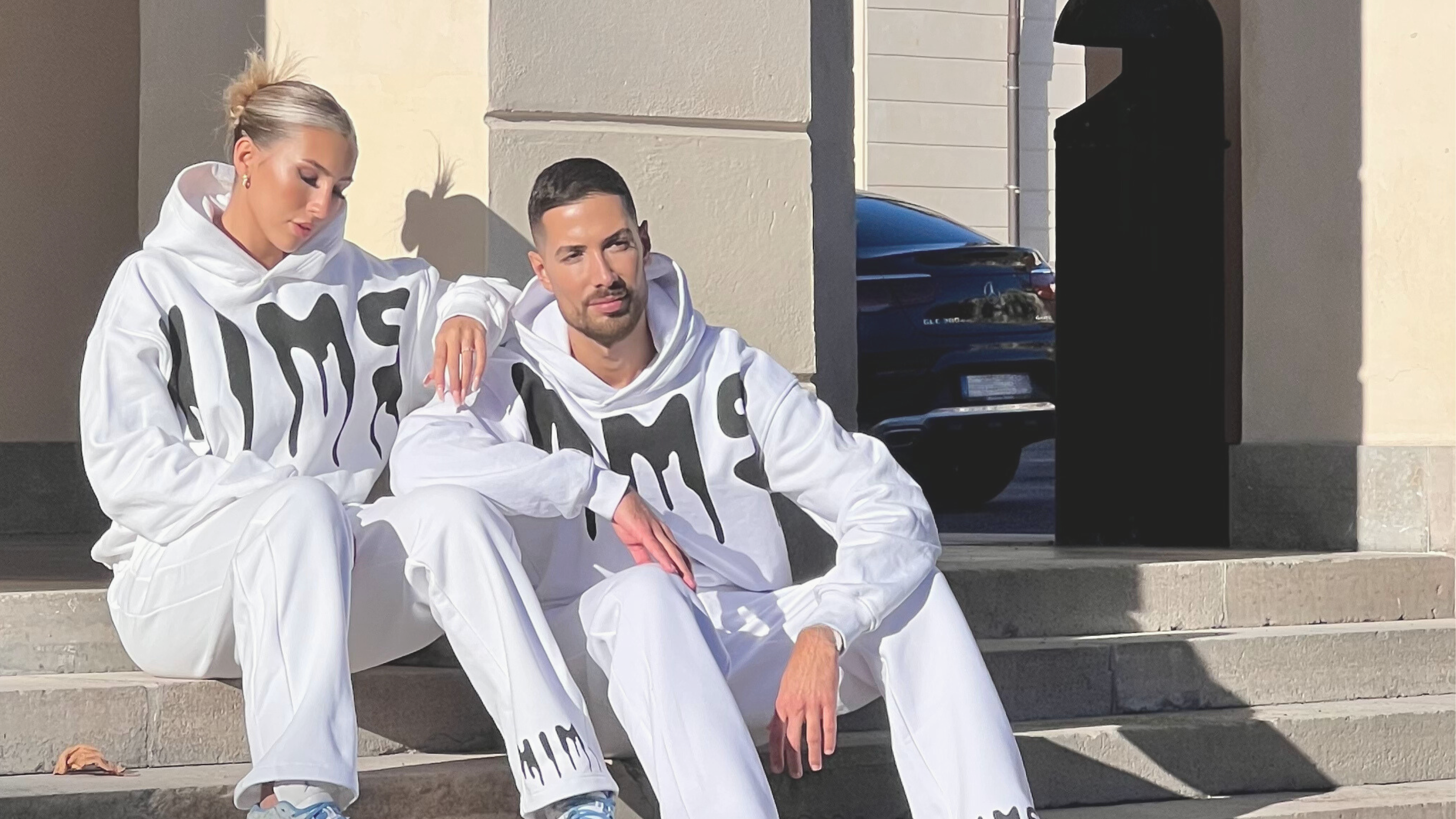 two models posing with white clothes